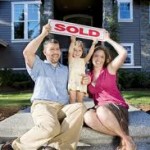 Family with sold sign